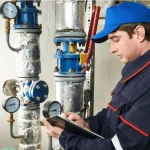 Gas Safe engineer carrying out a landlord boiler service and gas safety check