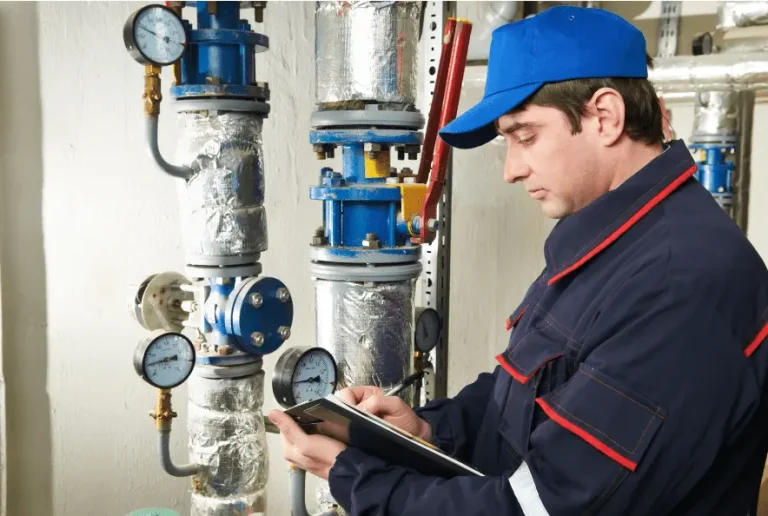 Gas Safe engineer carrying out a landlord boiler service and gas safety check