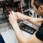 Residential fuse box being inspected during an EICR
