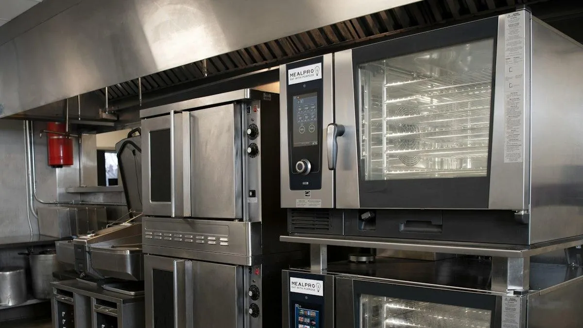 Commercial catering gas appliances, combi ovens, and mechanical extraction canopy in a London restaurant kitchen