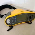 Electrician performing insulation resistance testing during an EICR